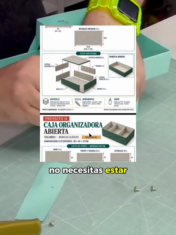 Vista previa del video: las láminas de proyecto y una caja de cartonaje en la mesa de trabajo